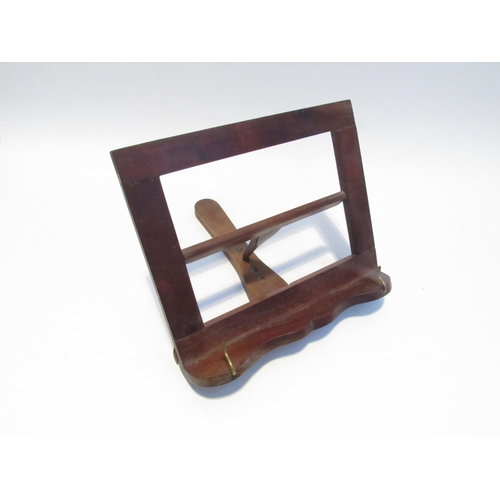 7105 - A mahogany folding tabletop  music stand.  24.5cm x 28.5 cm x 29 cm