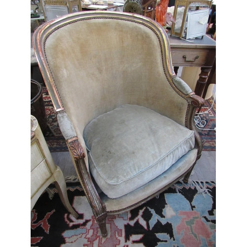 7108 - A late 19th Century French velour upholstered spoon back armchair with gilt frame, feather filled se... 