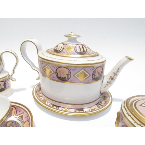 7111 - A circa 1800 English porcelain coffee and tea set decorated with ancient monuments gilt embellishmen... 