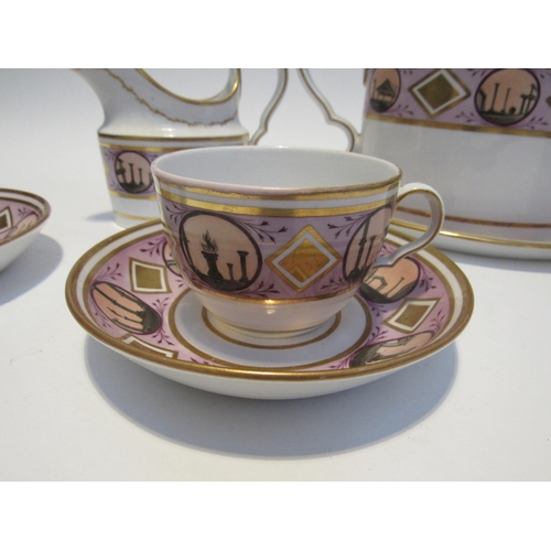 7111 - A circa 1800 English porcelain coffee and tea set decorated with ancient monuments gilt embellishmen... 