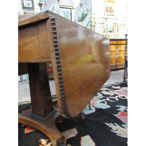 7119 - A late Regency / William IV mahogany drop-flap sofa table, 69.5cm x 92cm x 66.5cm   (R) £120