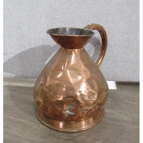 7154 - A Victorian copper four gallon jug, two gallon jug and a one gallon jug (dented), 42cm, 29cm & 26cm ... 