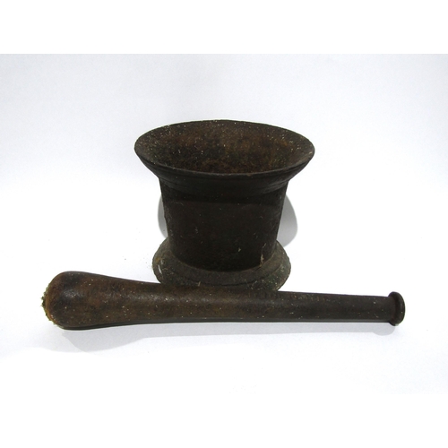 7158 - A large cast iron Georgian pestle and mortar.  The pestle with the ward cannon on the handle.  Pestl... 