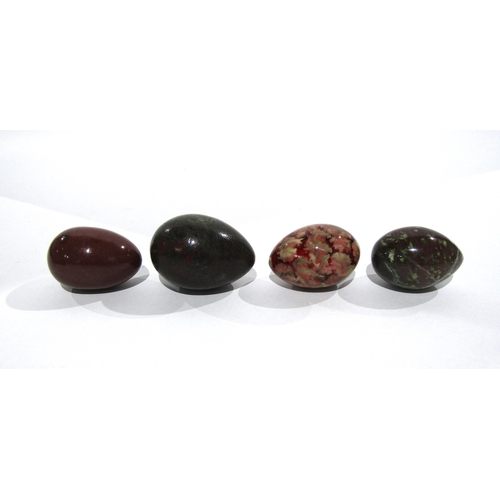 7170 - Seven polished stone eggs and another, all of varying sizes, largest 7cm, smallest 4cm