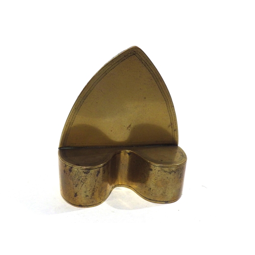 7196 - A Georgian brass candlestick and Georgian brass heart form snuff box, 16.5cm tall and 8.3cm long 
(2... 