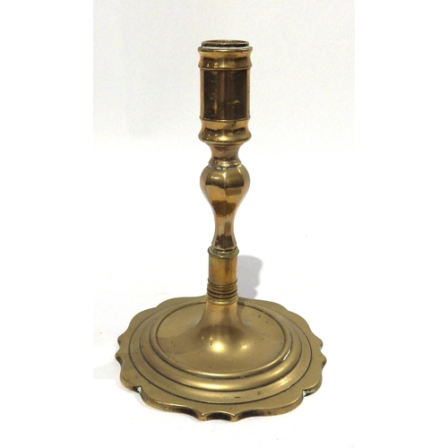 7196 - A Georgian brass candlestick and Georgian brass heart form snuff box, 16.5cm tall and 8.3cm long 
(2... 