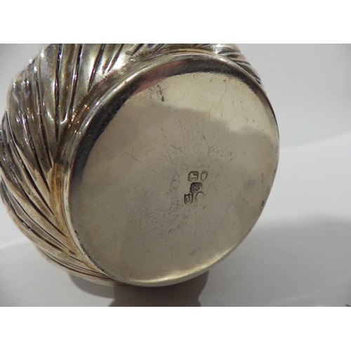 7206 - A Victorian silver embossed cup/pot makers mark double struck London 1887 6.5am tall, 9cm diameter a... 