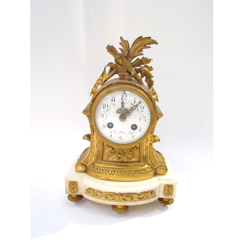 7616 - An early 19th Century French Ormolu mantel clock with white enamel dial, Arabic numerals with two tr... 