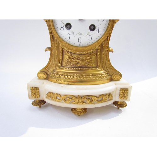 7616 - An early 19th Century French Ormolu mantel clock with white enamel dial, Arabic numerals with two tr... 