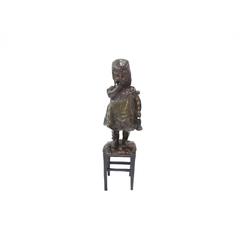 7617 - JUAN CLARA AYATS (1875-1958): A bronze sculpture of young girl standing on a rush seated stool, hold... 