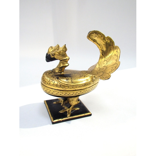 7623 - A Russian lacquered container as a bird, 17cm high