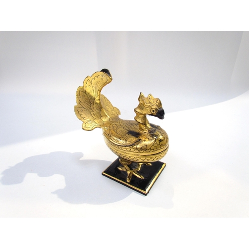 7623 - A Russian lacquered container as a bird, 17cm high