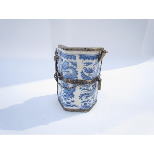 7629 - A Chinese Guangxu opium pot and pipe, white metal frame with blue and white dragon ceramic body, six... 