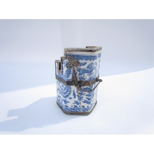 7629 - A Chinese Guangxu opium pot and pipe, white metal frame with blue and white dragon ceramic body, six... 