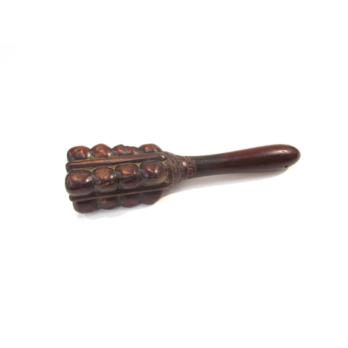 7630 - A late 19th early 20th Century tribal short club, possibly for throwing, 29cm long