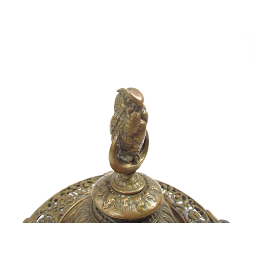 7633 - A Victorian pierced brass desk inkwell with owl on crescent moon lid, scrolled foliate detail, 21.5c... 