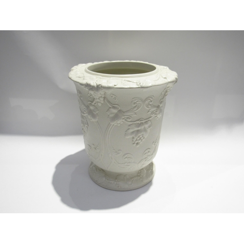 7729 - A Victorian Parian ware George Simpson’s Patent wine cooler, white porcelain, all over grape and vin... 