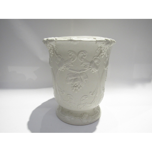 7729 - A Victorian Parian ware George Simpson’s Patent wine cooler, white porcelain, all over grape and vin... 