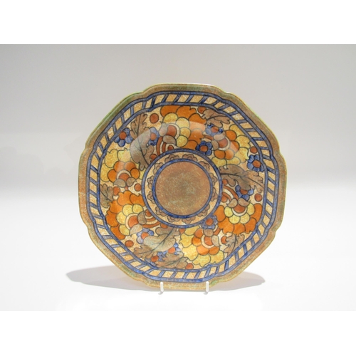 7730 - Two Charlotte Rhead chargers and a plate varying designs including orange foliate pattern 4921 for C... 