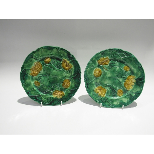 7732 - Two J. Adams & Co. majolica cabbage leaf plates in yellow and green, each 22.5cm diameter