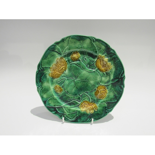 7732 - Two J. Adams & Co. majolica cabbage leaf plates in yellow and green, each 22.5cm diameter