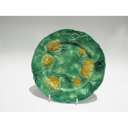 7732 - Two J. Adams & Co. majolica cabbage leaf plates in yellow and green, each 22.5cm diameter