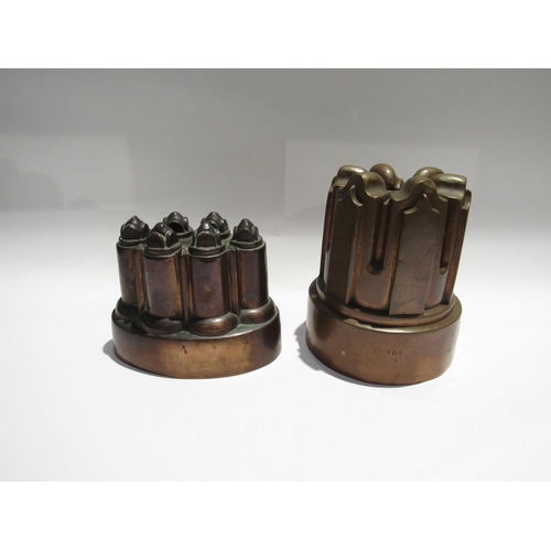 7733 - Four 19th Century copper jelly moulds. Three cast iron form, all varying in size. Three have monogra... 