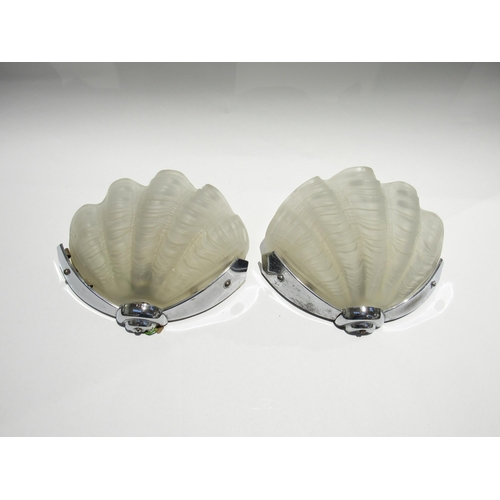 7735 - A pair of Art Deco wall lights, frosted shell shaped glass shades