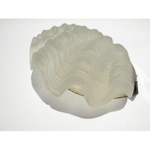 7735 - A pair of Art Deco wall lights, frosted shell shaped glass shades