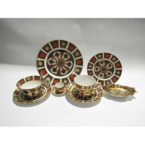 7738 - A quantity of Royal Crown Derby Imari palette ceramics to include cups, saucers, plates, pin dish et... 