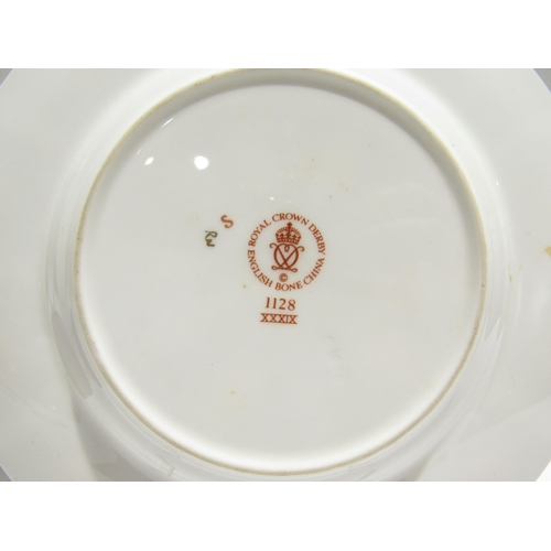 7738 - A quantity of Royal Crown Derby Imari palette ceramics to include cups, saucers, plates, pin dish et... 