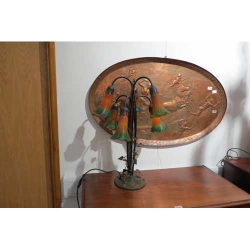 7762 - A six arm table lamp of Art Nouveau style with yellow and green fluted shades, creeping vine to stem... 