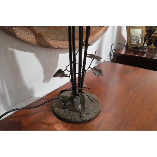 7762 - A six arm table lamp of Art Nouveau style with yellow and green fluted shades, creeping vine to stem... 