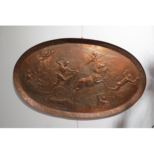 7764 - A circa 1900 copper oval tray of large proportions, repousse Romanesque chariot scene, 106cm x 63.5c... 