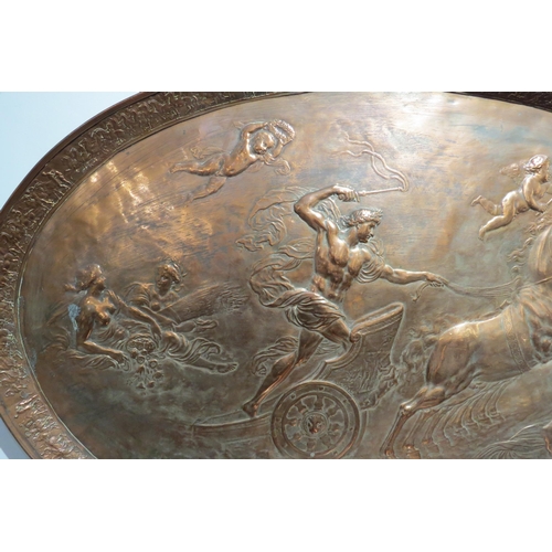 7764 - A circa 1900 copper oval tray of large proportions, repousse Romanesque chariot scene, 106cm x 63.5c... 