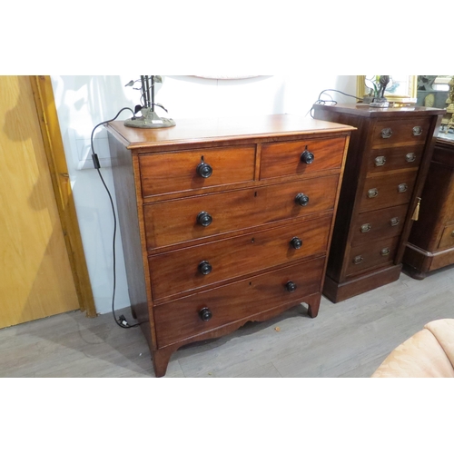 7767 - A Victorian flame mahogany chest of two short over three graduating long drawers with turned handles... 