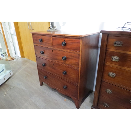 7767 - A Victorian flame mahogany chest of two short over three graduating long drawers with turned handles... 