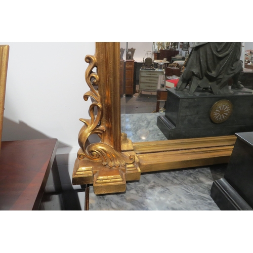 7771 - A 19th Century gilt overmantel mirror of domed form with acanthus embellishment, 137cm x 135cm