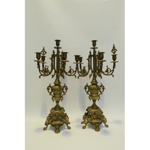 7772 - A pair of ormolu six sconce candelabra, scrolled detail, 60cm high