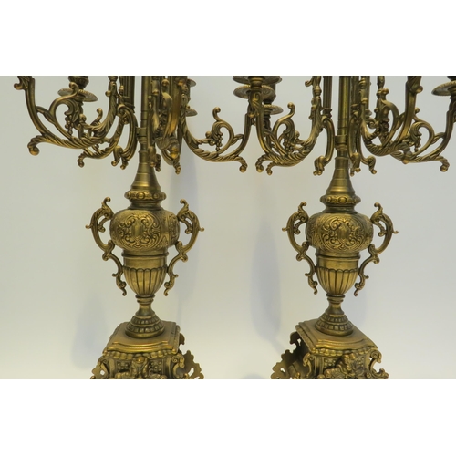 7772 - A pair of ormolu six sconce candelabra, scrolled detail, 60cm high