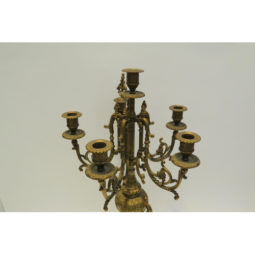 7772 - A pair of ormolu six sconce candelabra, scrolled detail, 60cm high