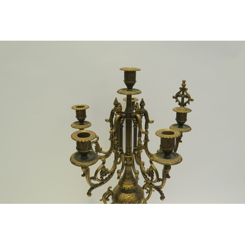 7772 - A pair of ormolu six sconce candelabra, scrolled detail, 60cm high