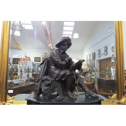 7773 - A 19th Century large state mantel clock, aloft a seated gent wearing period costume and hat holding ... 