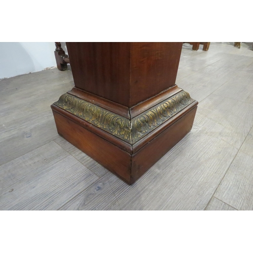 7776 - A Regency walnut pedestal of tapered form, 117cm tall