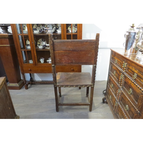 7783 - A late 17th/early 18th Century Spanish walnut chair with leather back and seat (repairs and distress... 