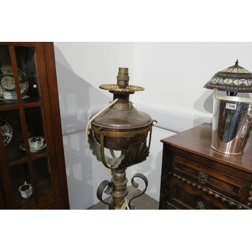 7784 - A Victorian floor standing oil lamp converted to electric, copper and brass lamp top, or copper and ... 