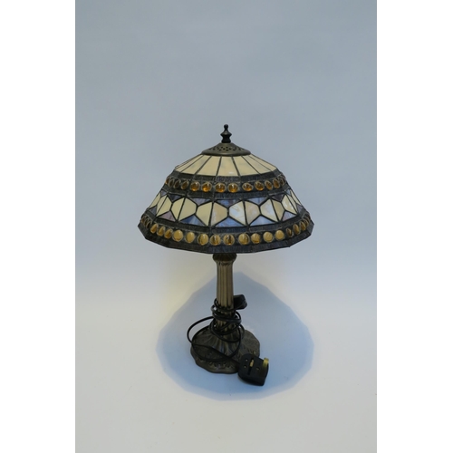 7785 - A pair of Tiffany style leaded stained glass table lamps, Art Nouveau style bronzed bases, 42cm tall