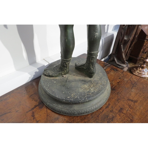 7787 - A cast metal sculpture of Dionysus / Narcissus standing 62cm high, verdigris effect