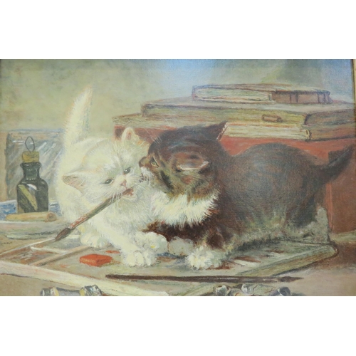 7791 - A 20th Century oil on canvas, relined. After Henriette Ronner 'A disagreement upon a point of art', ... 