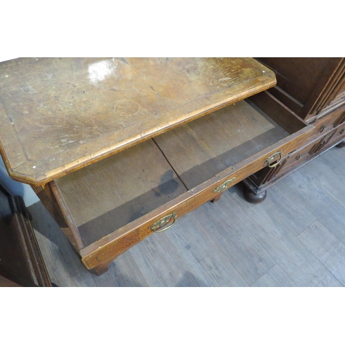 7795 - An 18th Century walnut kneehole desk, canted corner top over nine drawer and single door cabinet, he... 